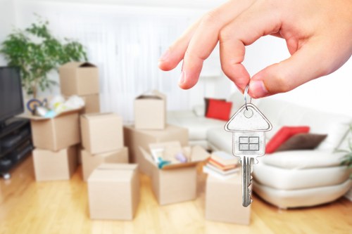Staff member using proper lifting technique during a move