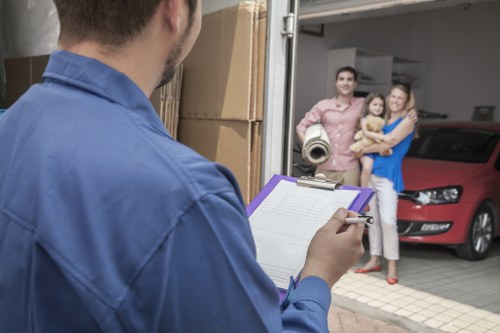 Organized storage unit in Farringdon with packed boxes and furniture