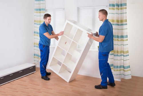 Careful handling of a piano during a Farringdon property move