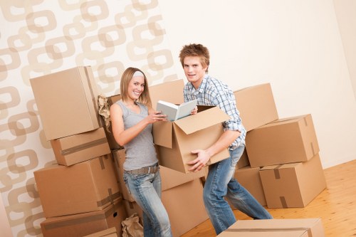 Professional movers handling office equipment during relocation