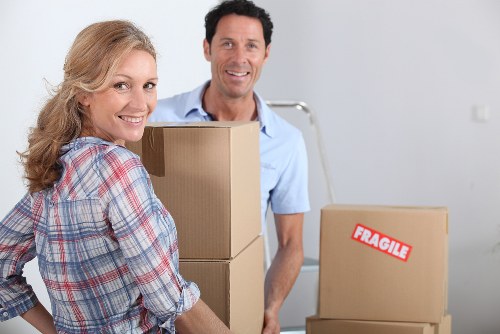 Local removals team handling boxes and furniture in Farringdon