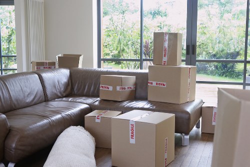 Moving crew wearing PPE and handling furniture carefully